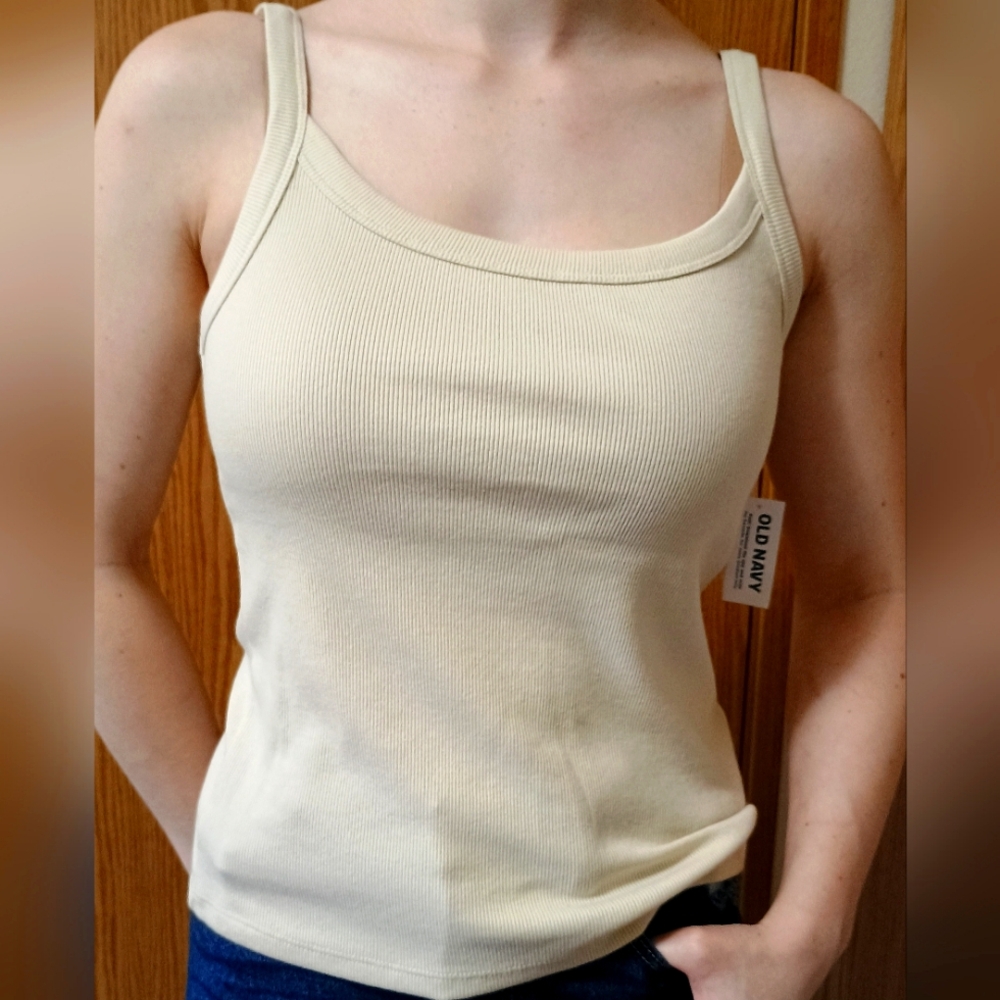 Cream colored tank top. Size M